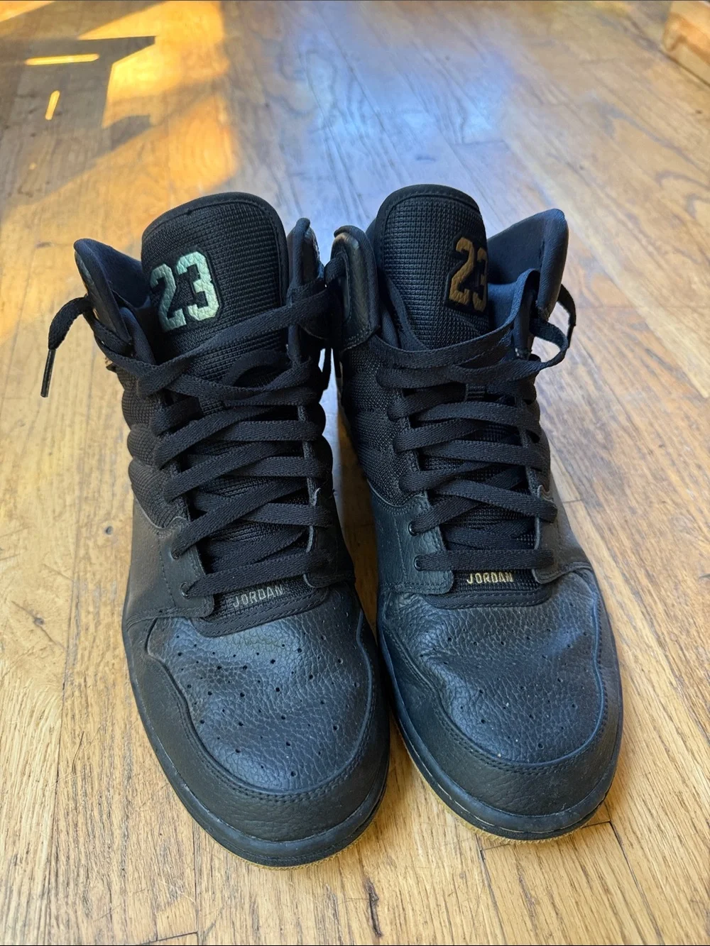 Jordan Black High-Top Sneakers with Metallic Accents